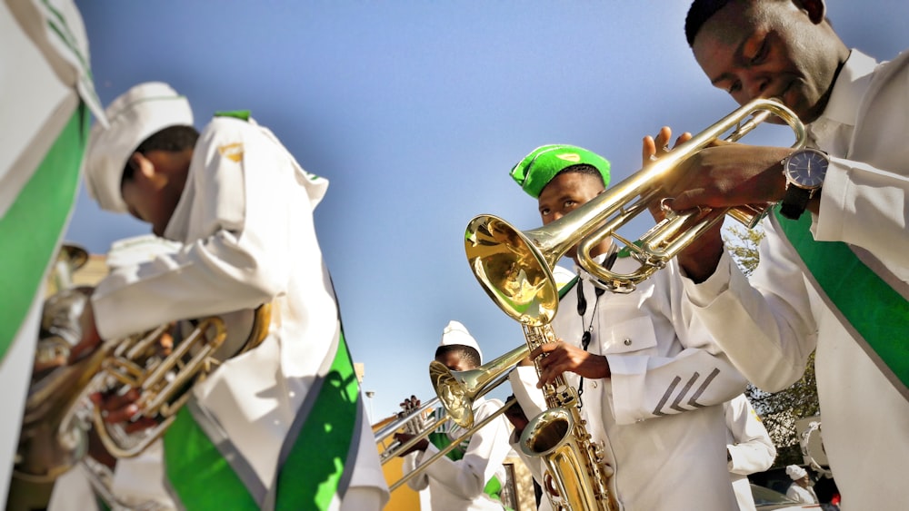 men playing musical instrument during daytime