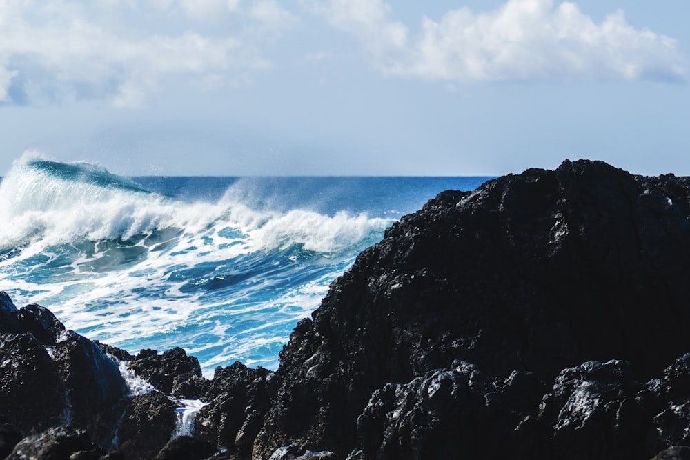 breaking waves near rocky beach