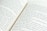 A close-up view of an open book displaying two pages. The text is in English, and the pages are slightly curved, suggesting the book is lying flat. The focus is on the middle section where the pages meet, and the text is clearly legible.