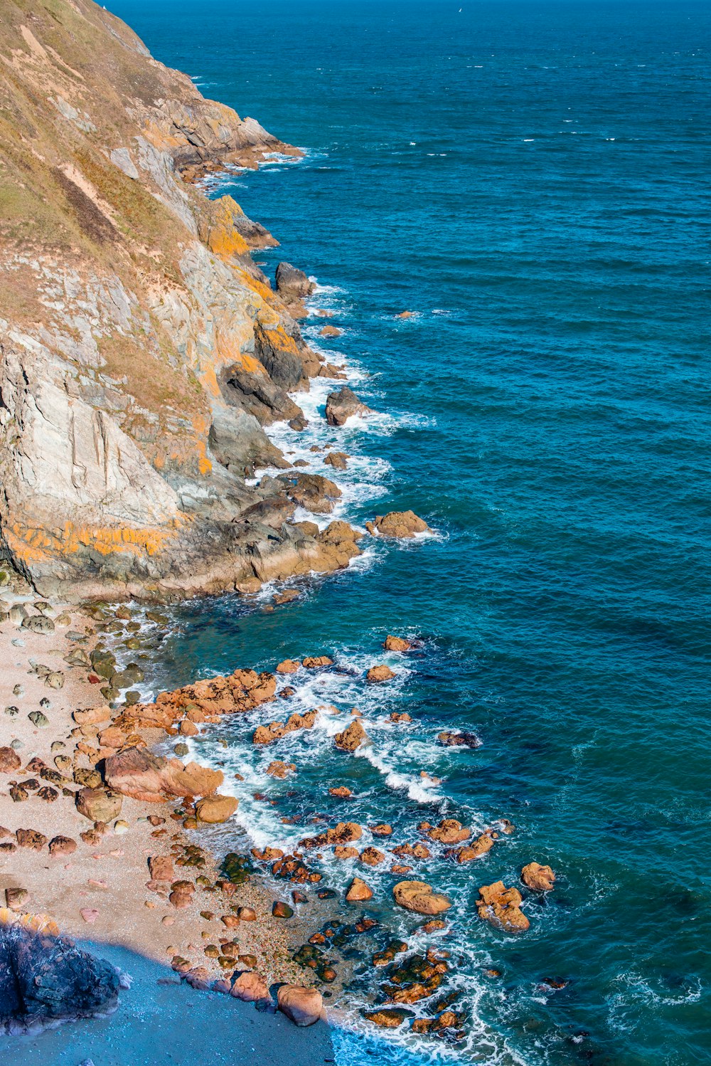 rocky beach in foot of hill