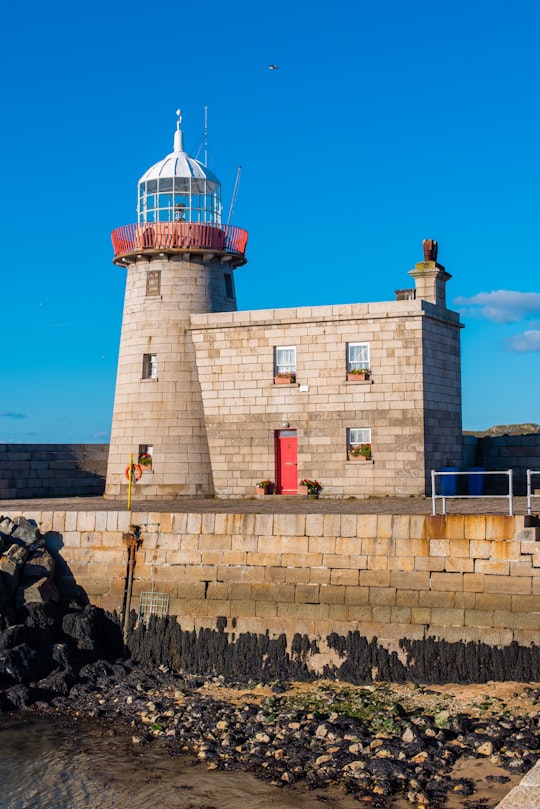 brown brick building with lighthouse in Howth Lighthouse Ireland