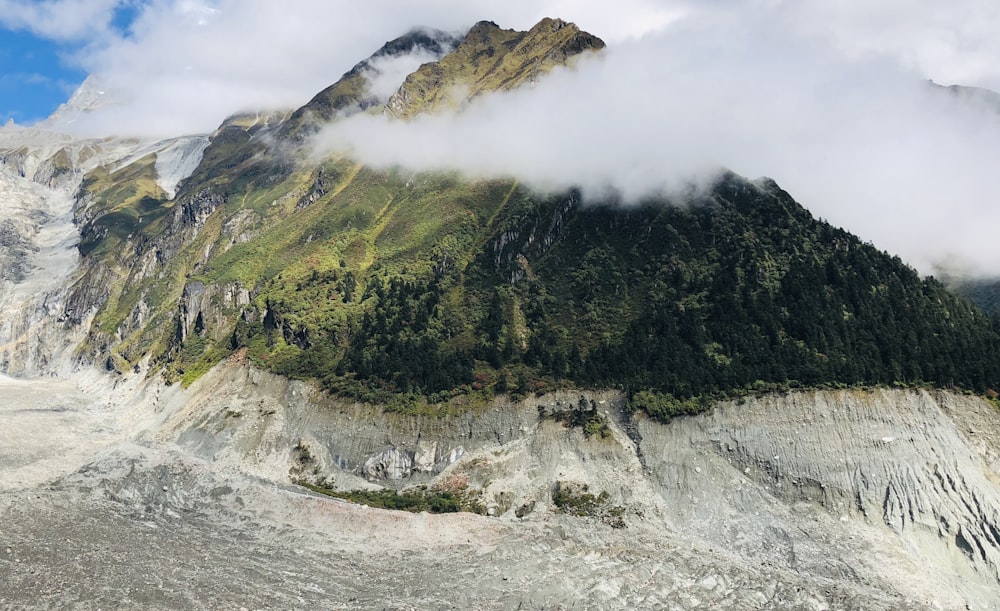 mountains surrounded with water during daytime