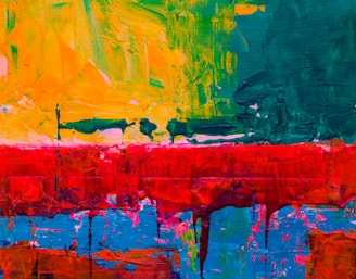 an abstract painting of red, yellow, and green