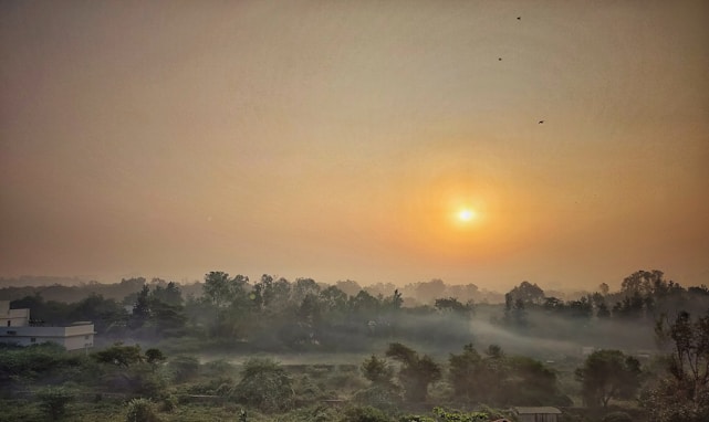 A serene sunrise over a peaceful meditation garden, inviting calm and hope.