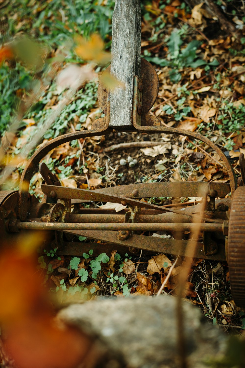 brown reel mower on ground