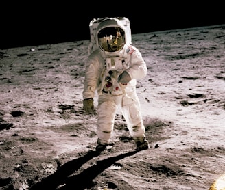 astronaut standing on gray sand