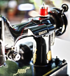 focus photography of Singer sewing machine
