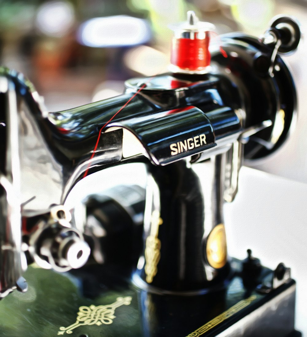 focus photography of Singer sewing machine