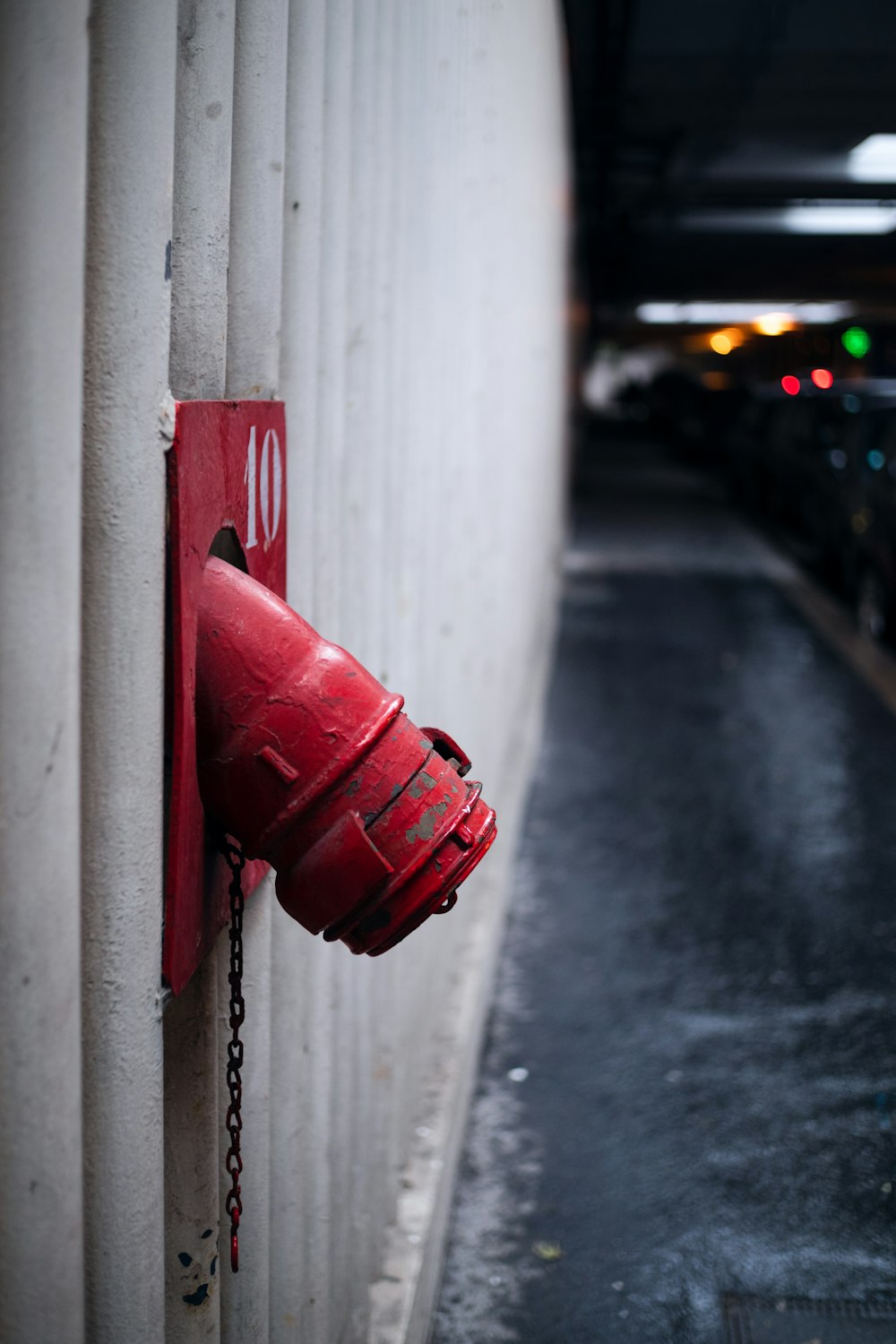 water tube on wall near road