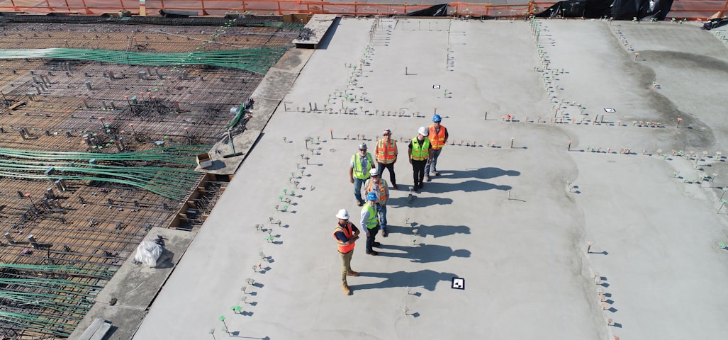 seven people standing on rooftop