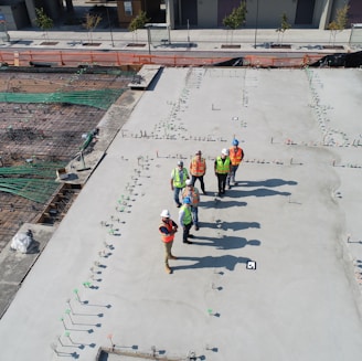 seven people standing on rooftop