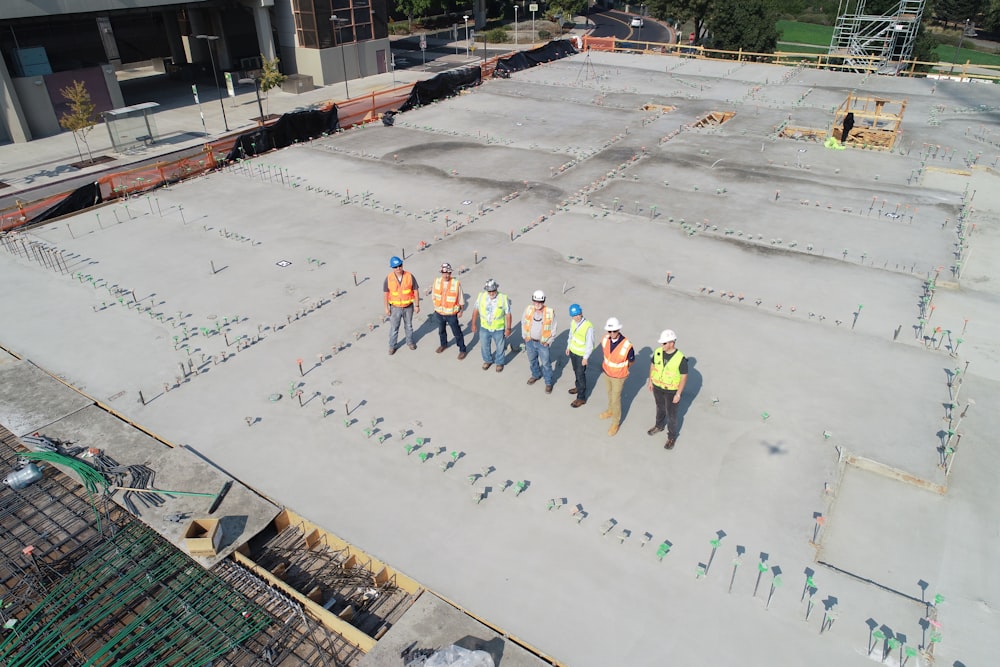 seven people standing on rooftop