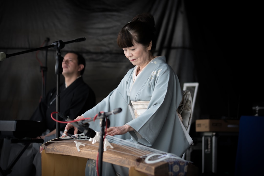 woman playing string musical instrument