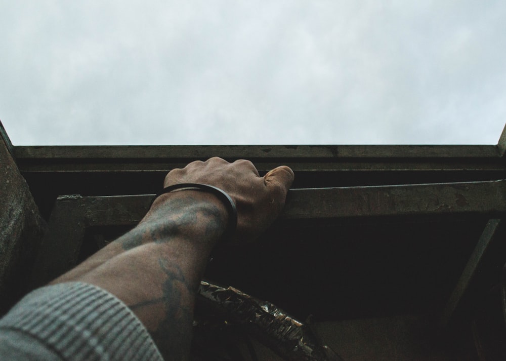 man holding metal bar