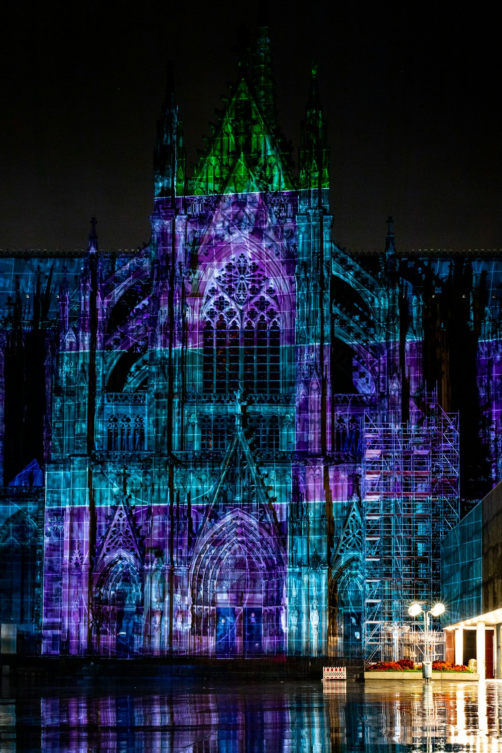 lighted church surrounded by body of water