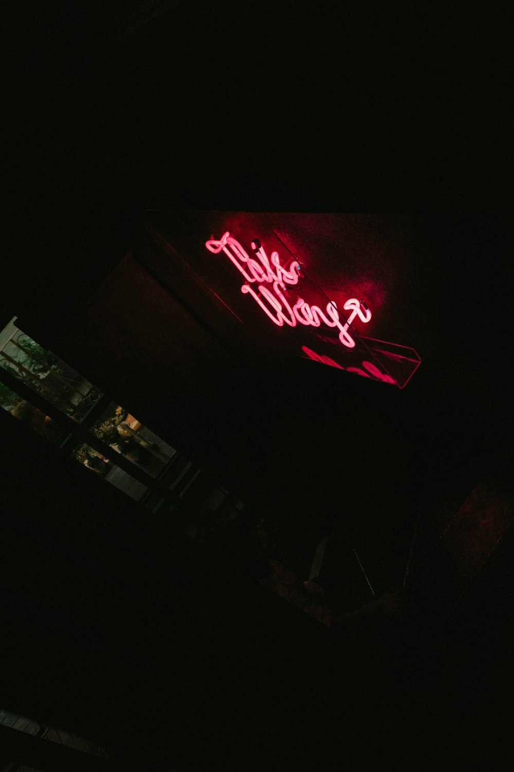 a red neon sign that reads, the seagull