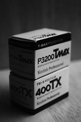Two black Tmax film boxes