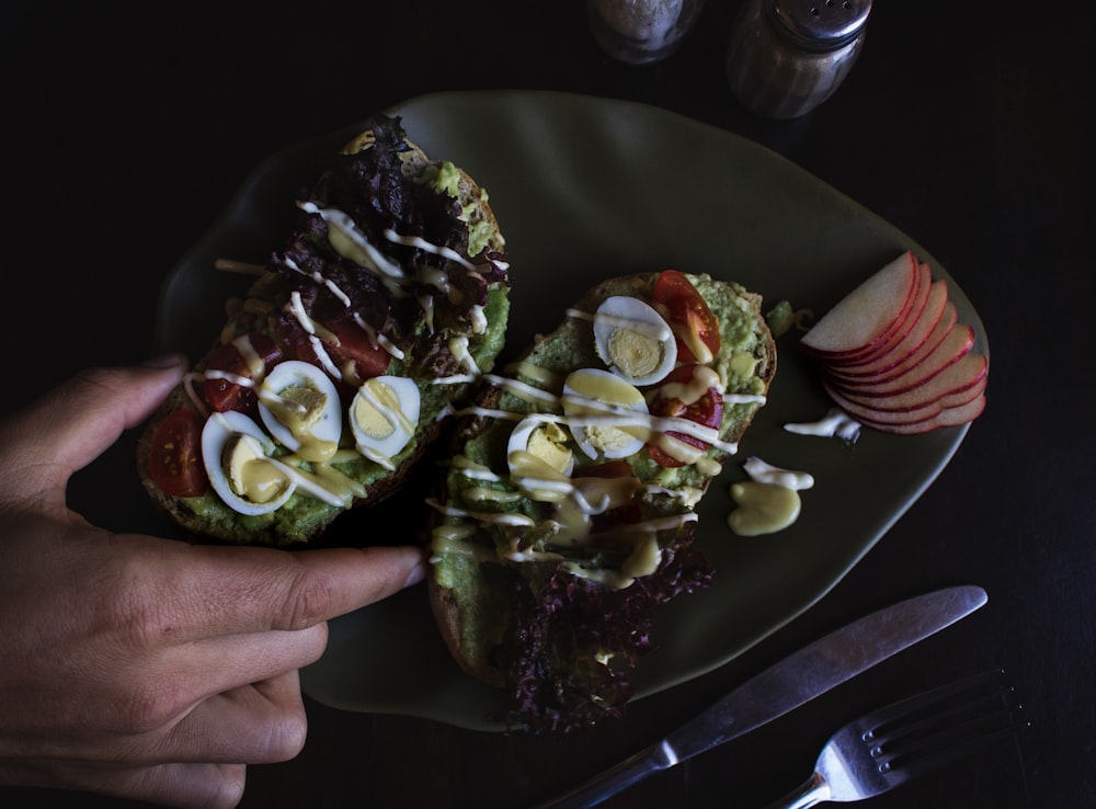 sliced bread with egg toppings on plate