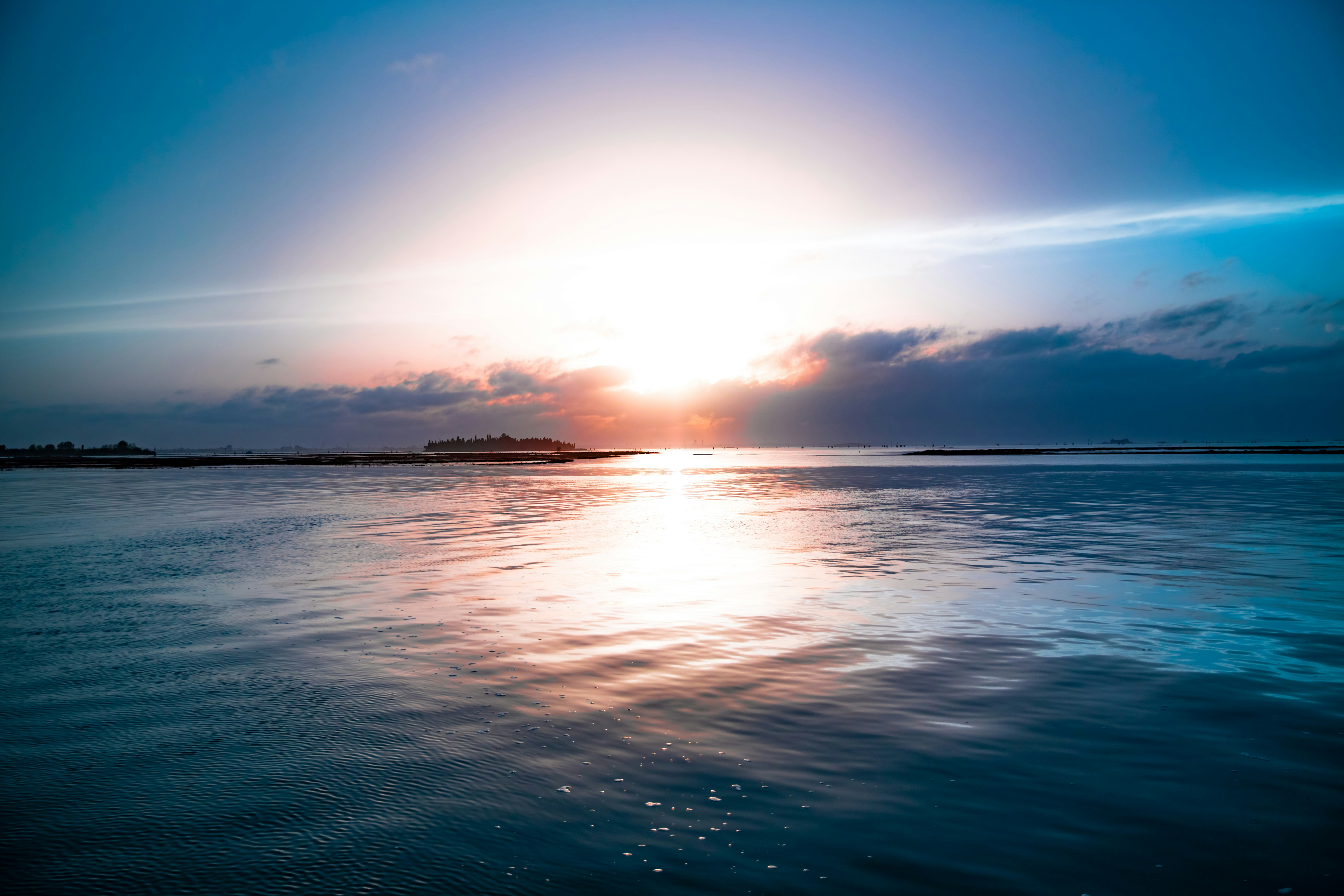 body of water during golden hour