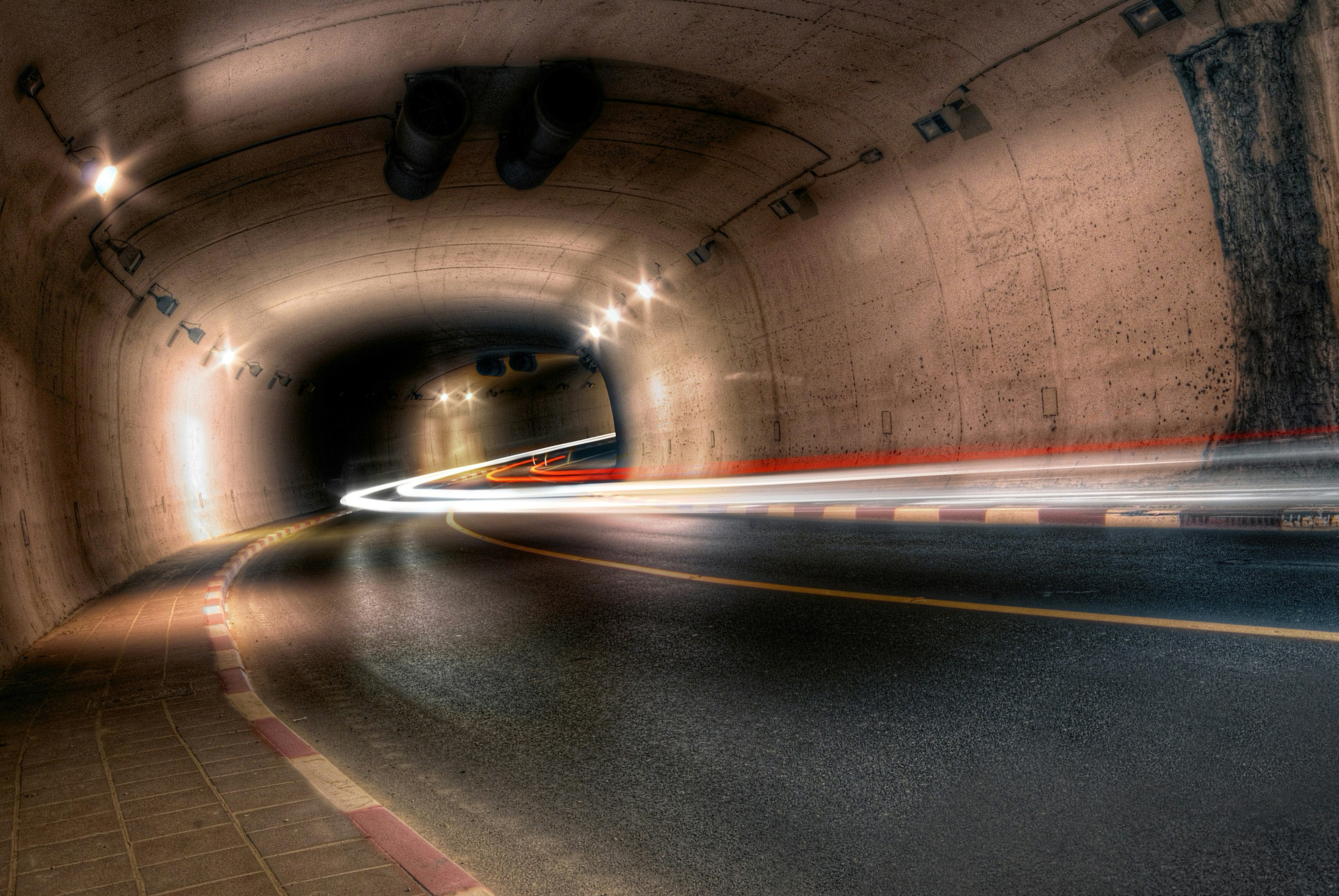 time-lapse photography of underpass with lights