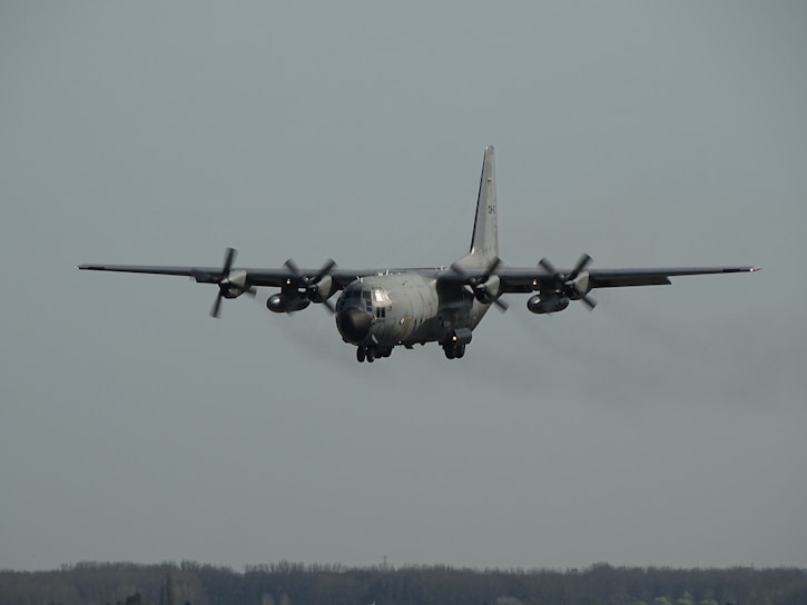 gray plane on sky during cloudless sky