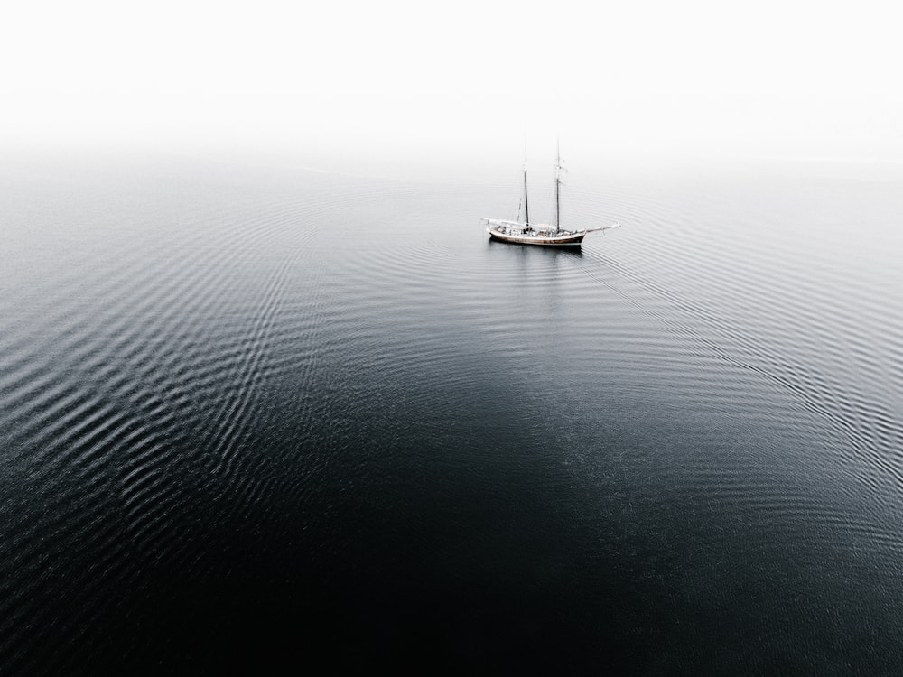 ship on water during cloudless sky