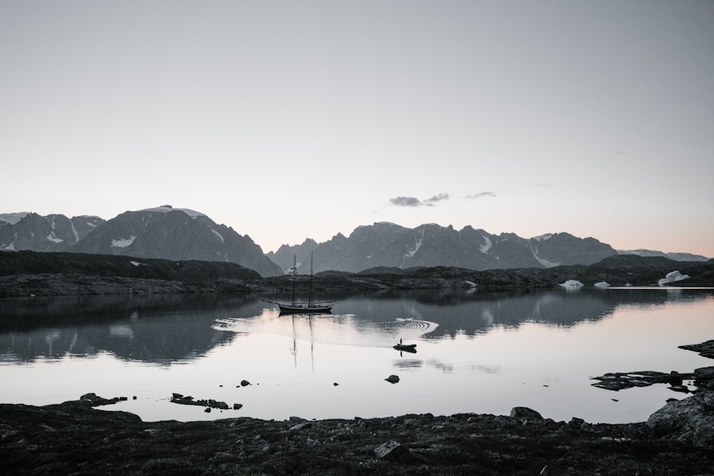 body of water under white sky