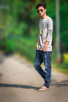 A hopeful young person walking confidently on a sunlit path symbolizing new beginnings.