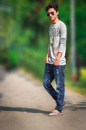 A youthful person walking confidently in casual espadrilles on a sunny urban street.