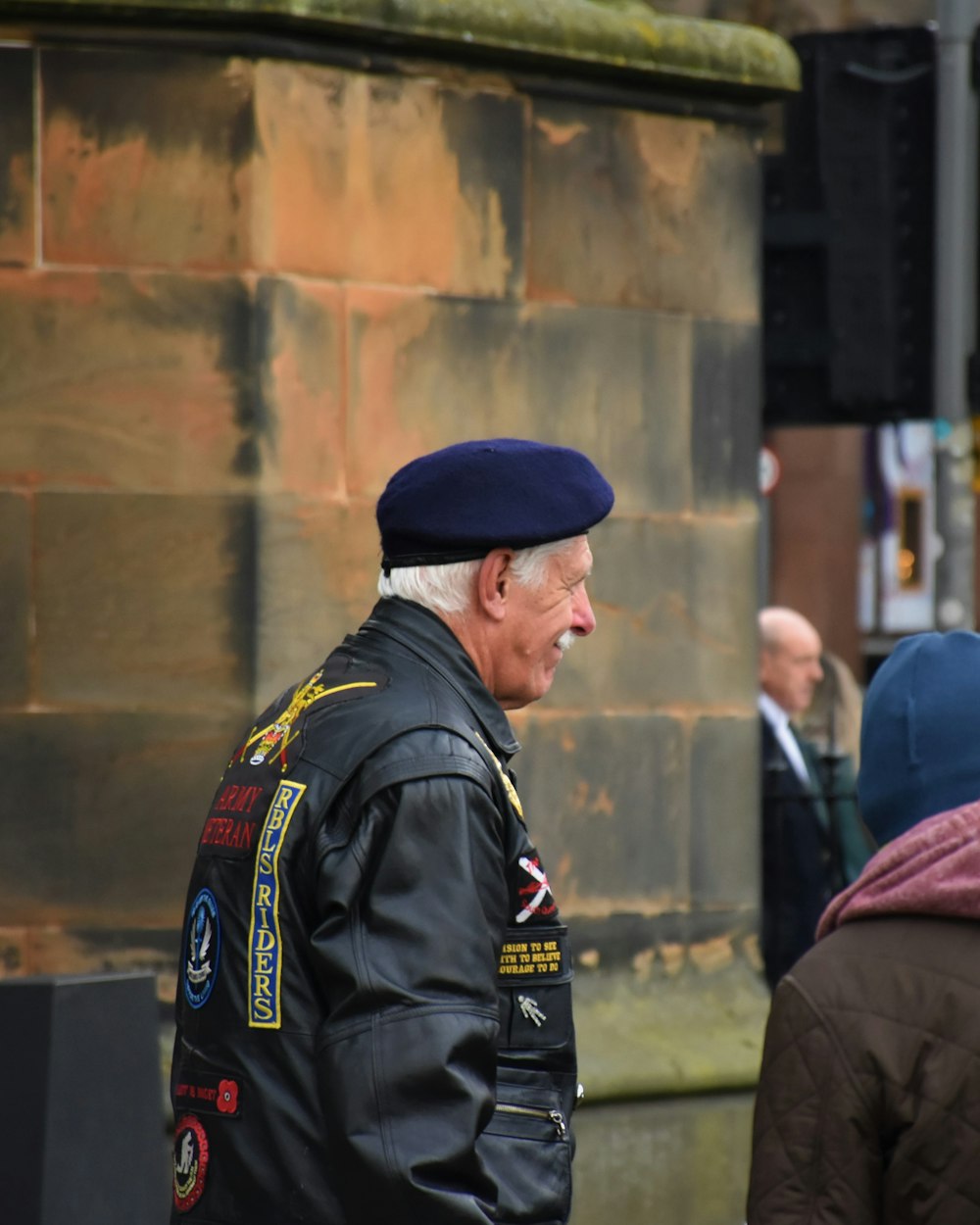 smiling man standing near building