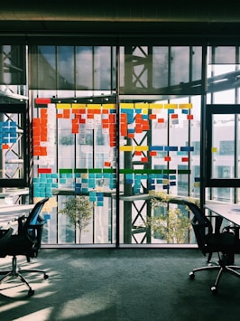 black rolling armchair under white table