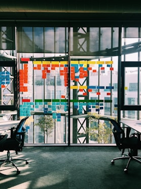 black rolling armchair under white table