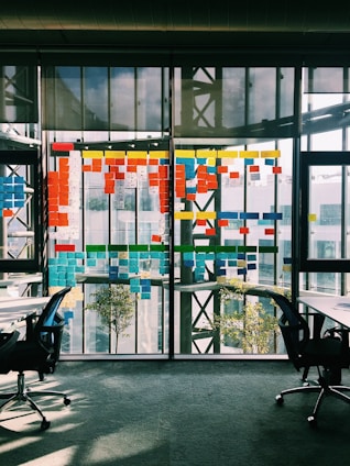 black rolling armchair under white table