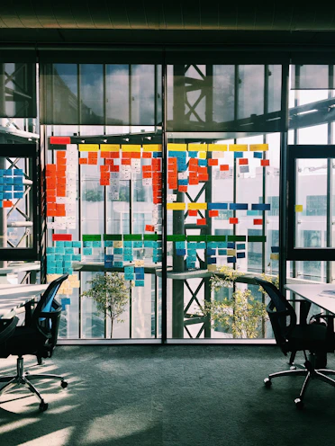black rolling armchair under white table