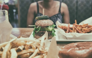 burger beside potato fries