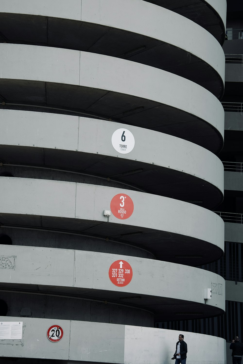 man passing by near high rise building