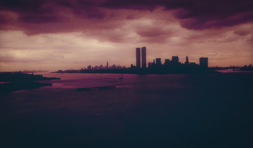 silhouette of buildings under dark sky