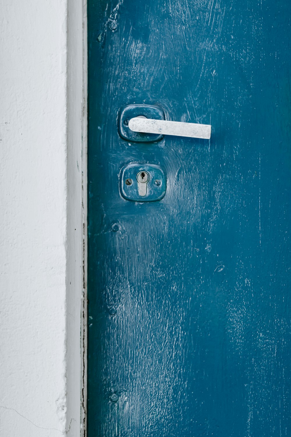 blue and white metal door closed