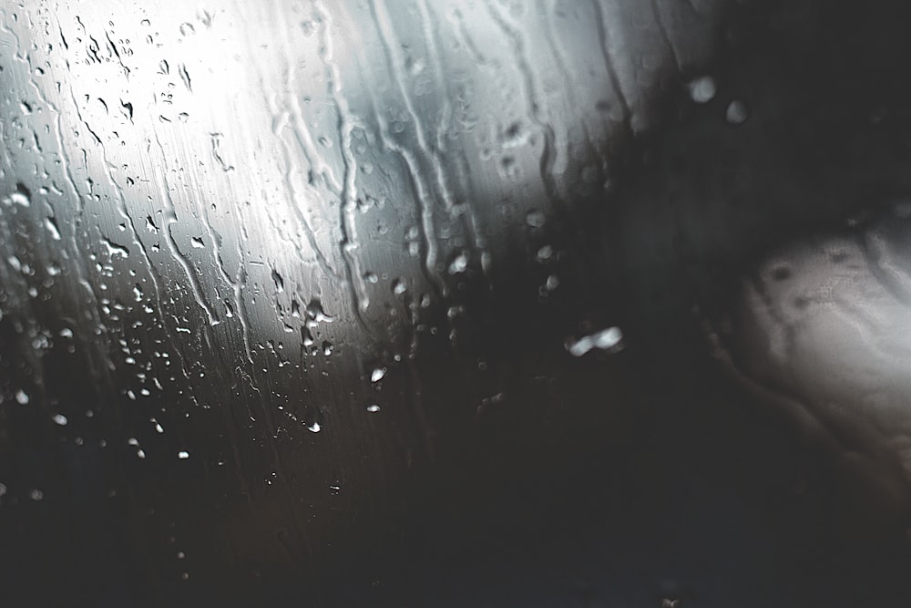 a close up of a rain covered window