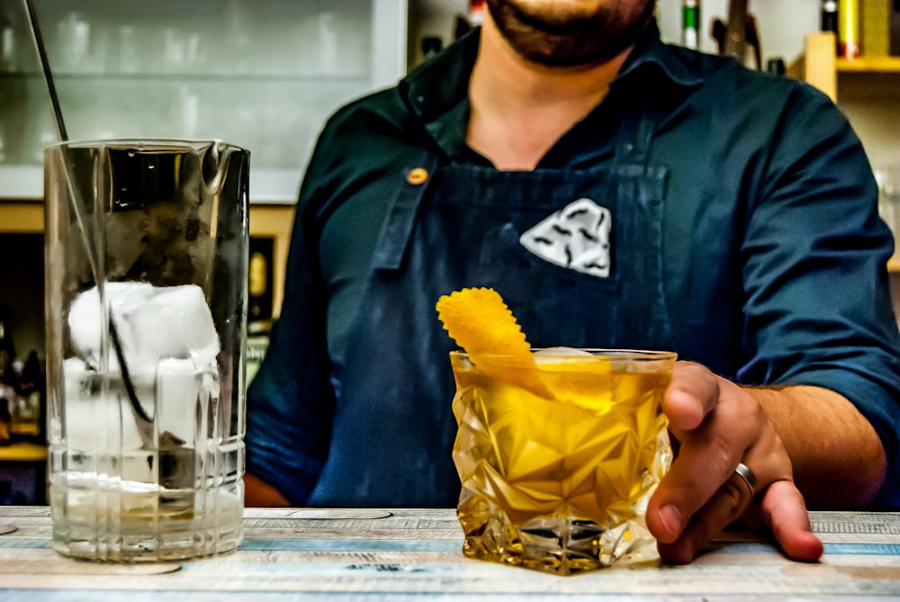 shot glass filled with yellow liquid