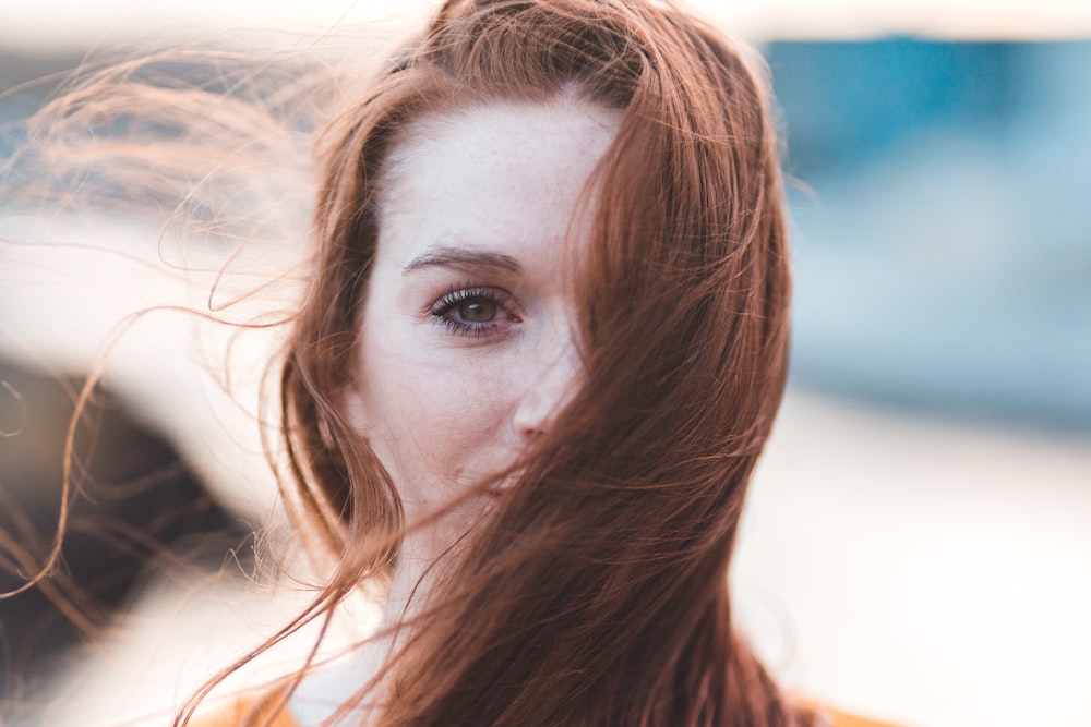 woman's face covered with hair