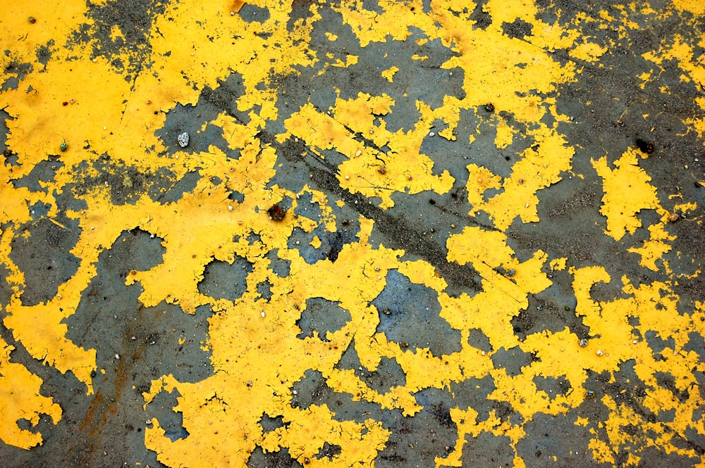 a close up of a yellow and black surface