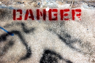 concrete ground with red danger text print