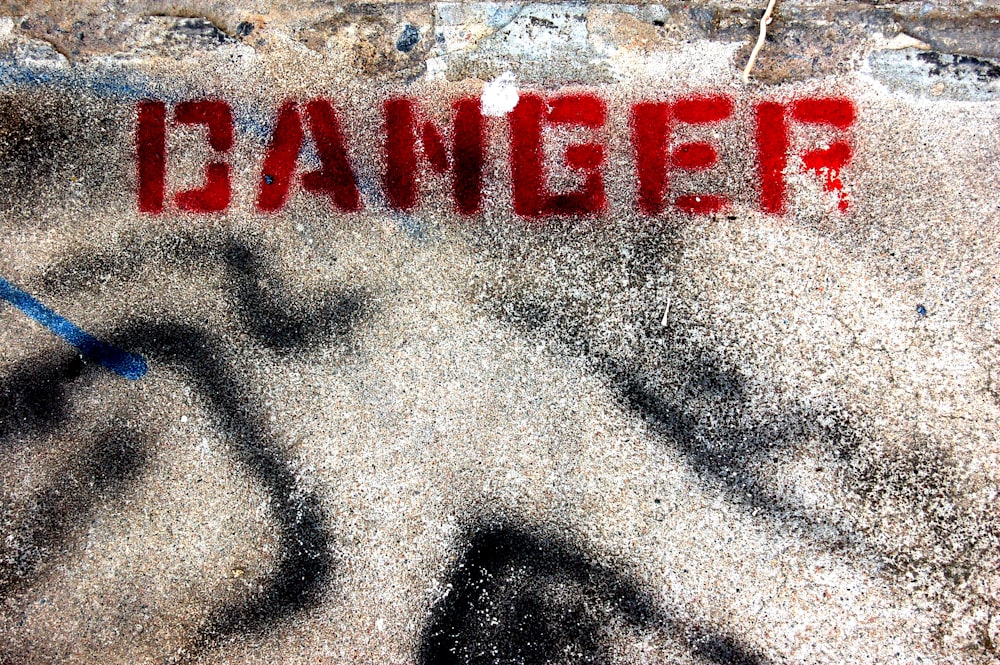 concrete ground with red danger text print