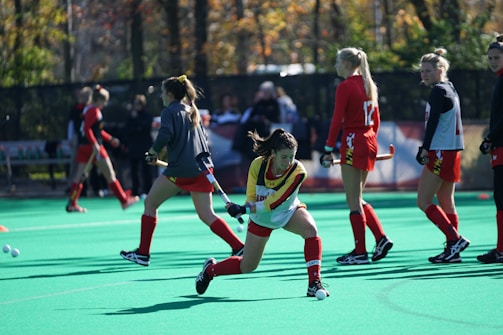 Young female hockey players practicing on ice rink during training session