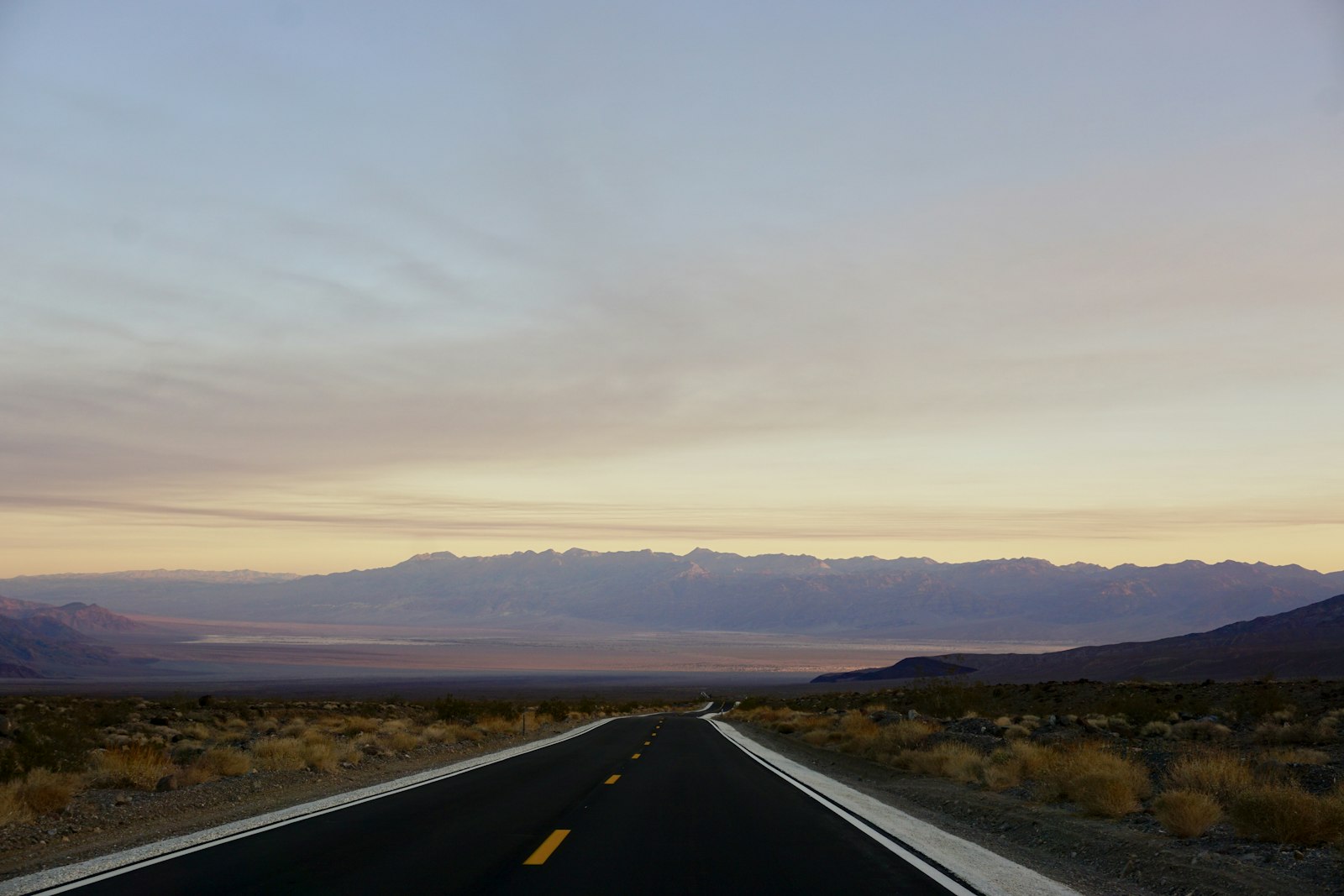 Sony a6000 + Sony E 18-50mm F4-5.6 sample photo. Black road under cloudy photography