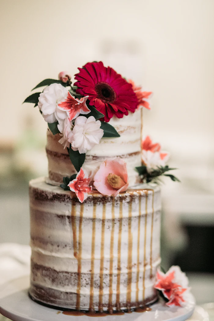 White icing-covered cake with flowers
