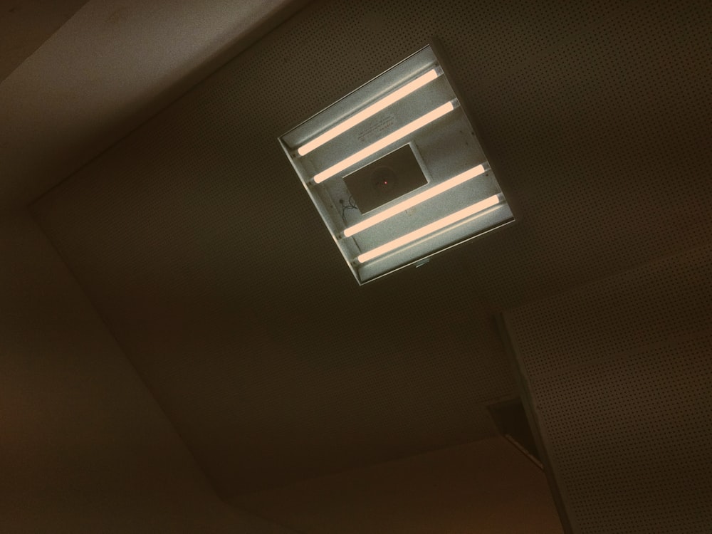 white fluorescent lights mounted on the ceiling