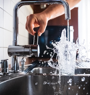 person opening faucet