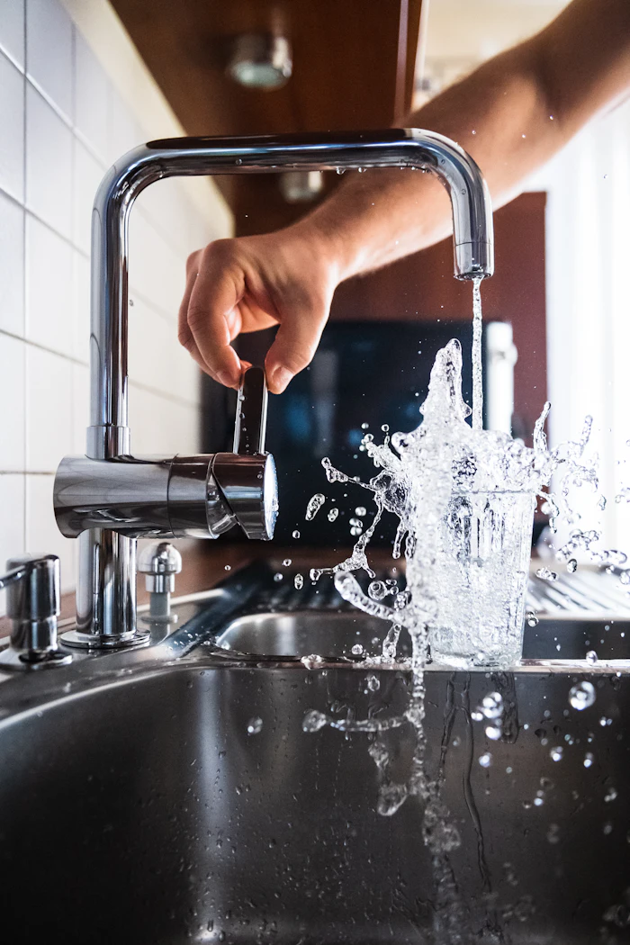 Running water from a kitchen faucet after a softener install is tested